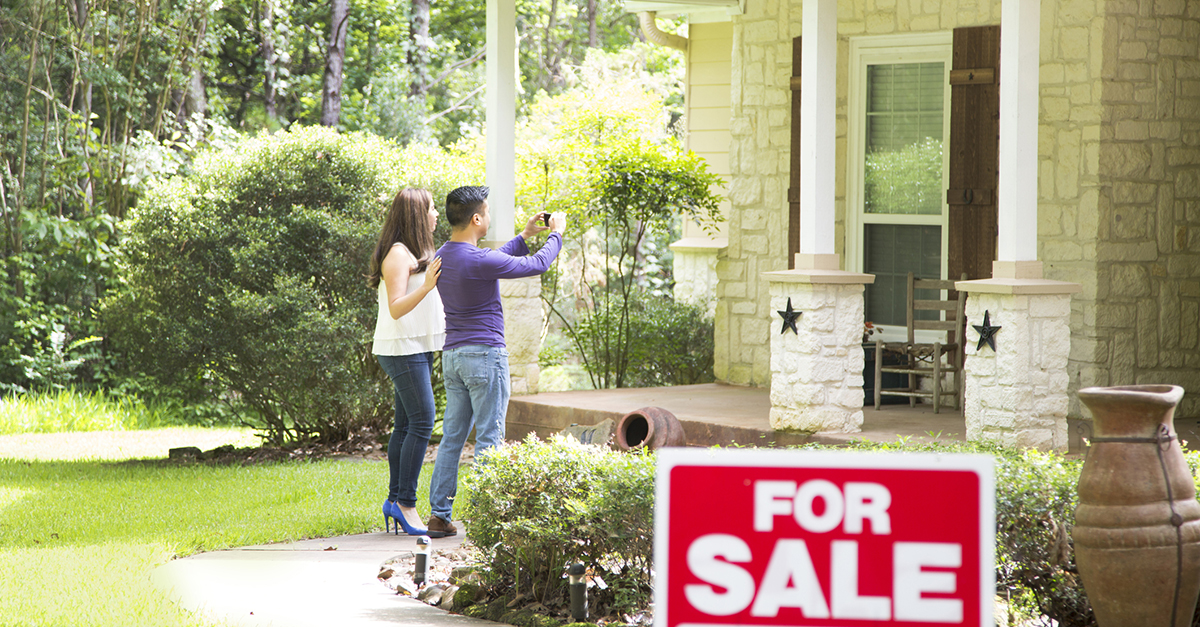 A couple visiting a home for sale